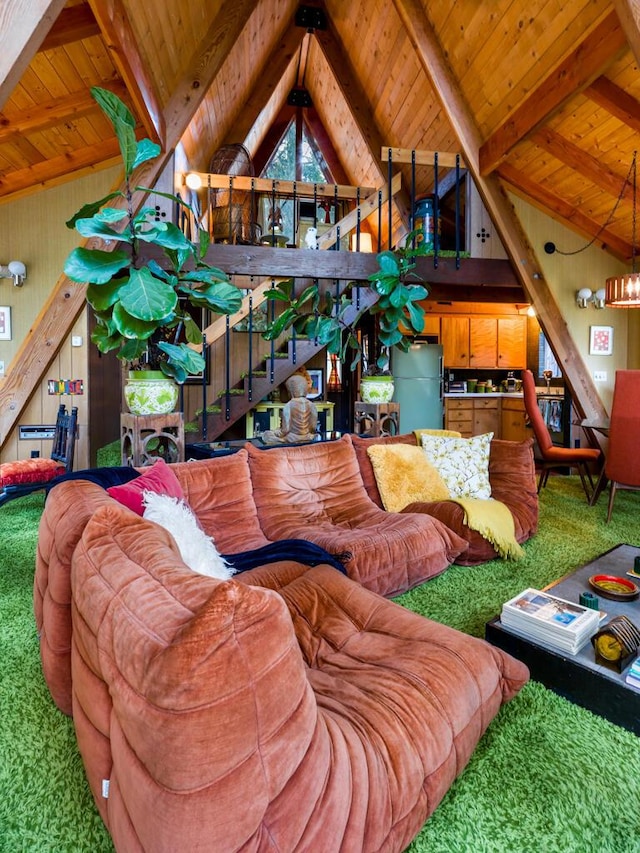 living room with vaulted ceiling with beams, wooden ceiling, and carpet flooring