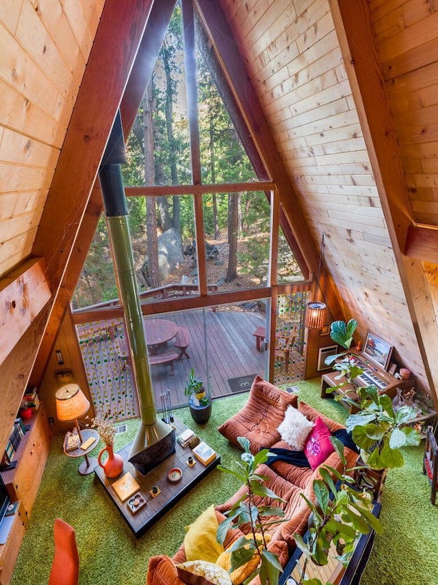 additional living space featuring vaulted ceiling with beams, wooden ceiling, and wood walls