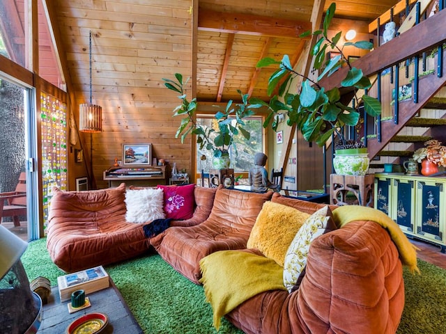 living room featuring vaulted ceiling with beams, plenty of natural light, wooden ceiling, and wood walls