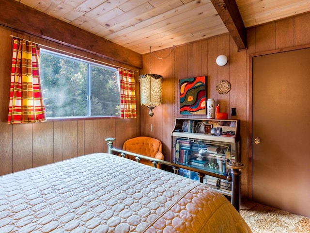 bedroom with beamed ceiling, wooden ceiling, carpet flooring, and wood walls