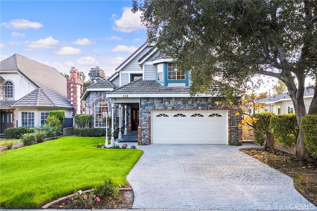 view of front facade with a front yard and a garage