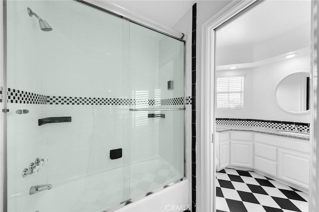 bathroom featuring bath / shower combo with glass door