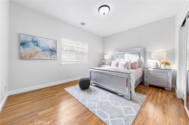 bedroom featuring wood-type flooring