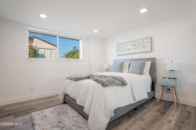 bedroom with hardwood / wood-style floors