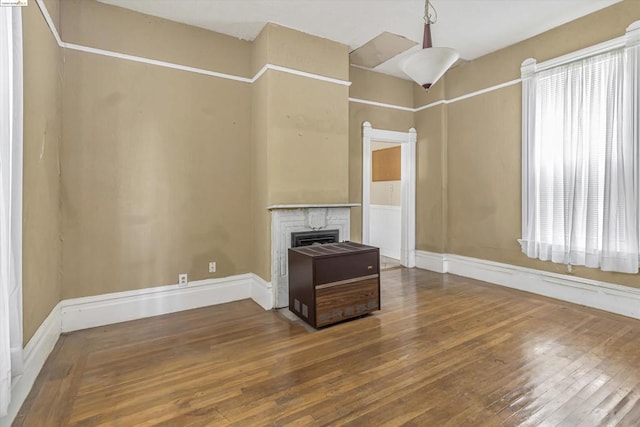 unfurnished living room with wood-type flooring