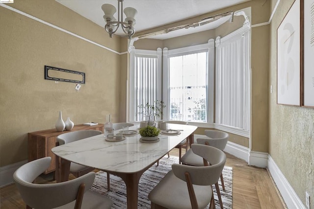 dining space featuring a notable chandelier