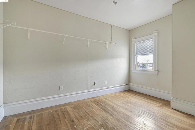 empty room with light hardwood / wood-style floors