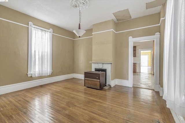 unfurnished living room featuring wood-type flooring