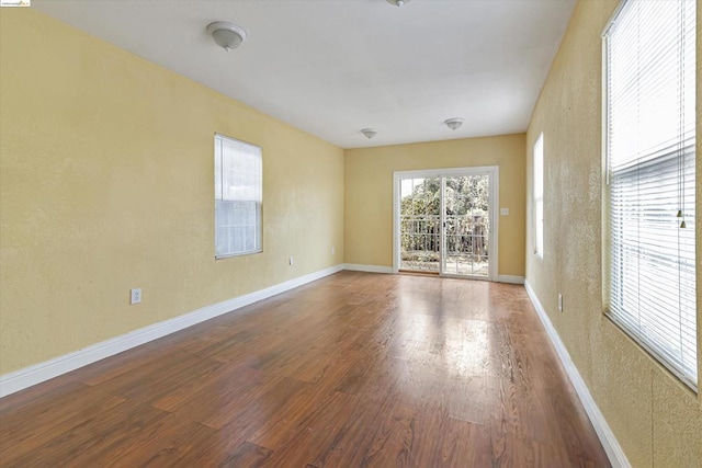 unfurnished room featuring wood-type flooring