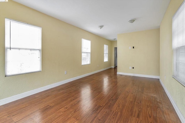 spare room featuring dark hardwood / wood-style floors