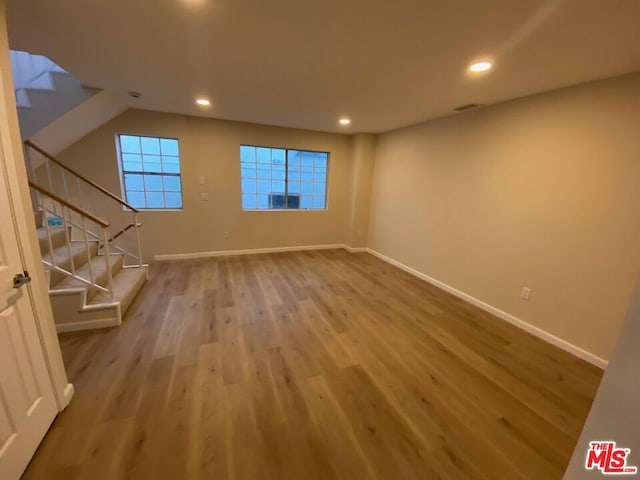 unfurnished living room featuring light hardwood / wood-style flooring