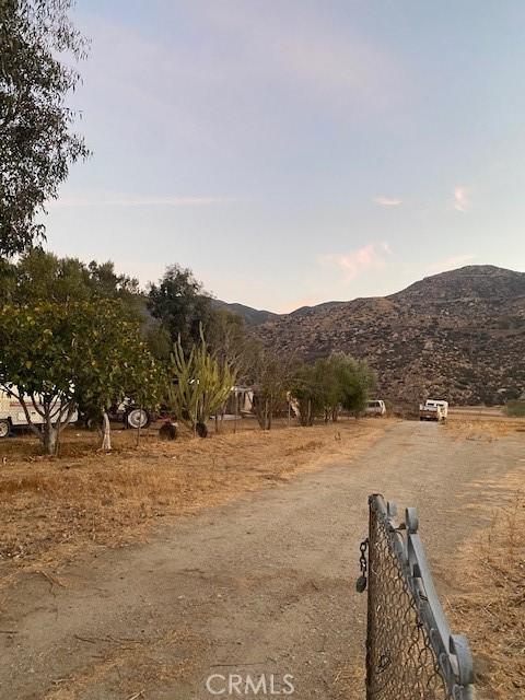 view of street with a mountain view and a rural view