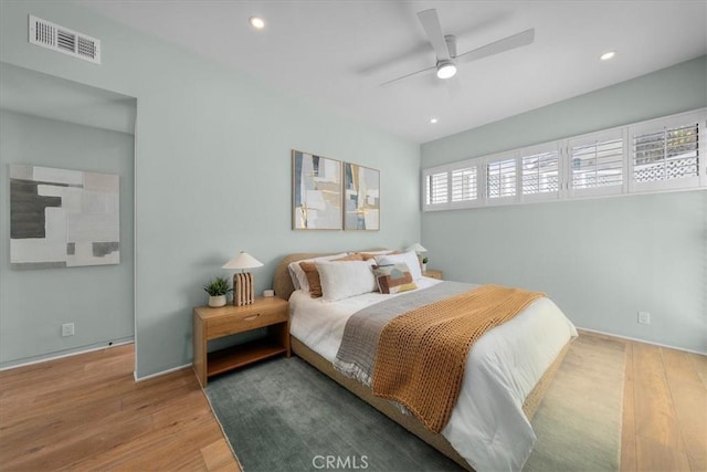 bedroom with hardwood / wood-style flooring and ceiling fan