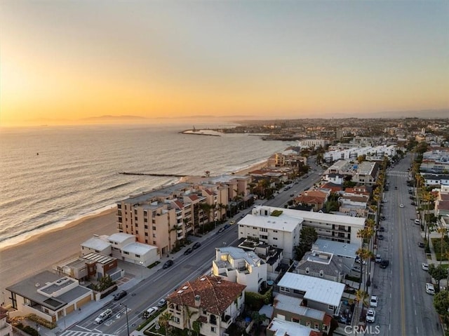 aerial view at dusk with a water view