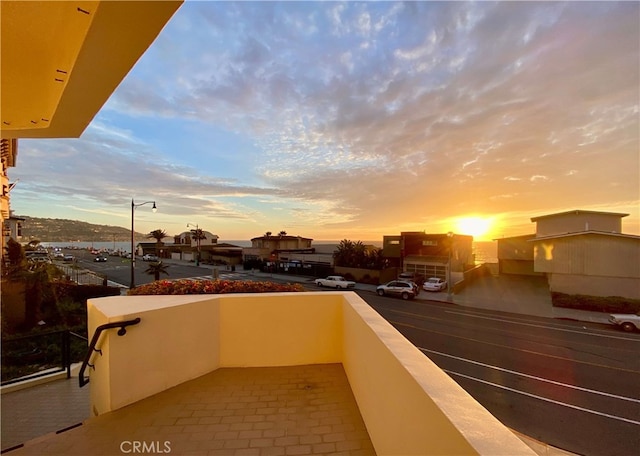 view of balcony at dusk