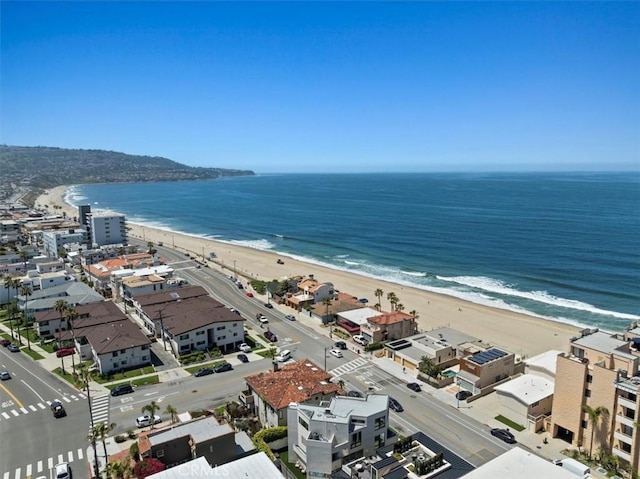 drone / aerial view featuring a view of the beach and a water view