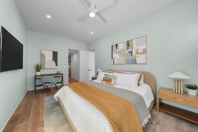 bedroom with ceiling fan and wood-type flooring