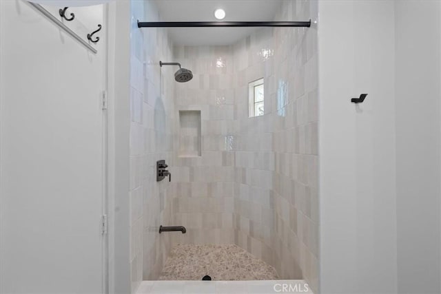 bathroom with a tile shower