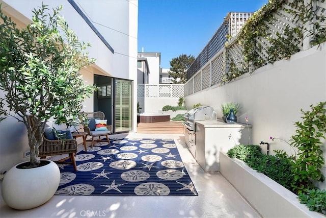 view of patio / terrace featuring area for grilling and a grill