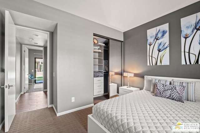 bedroom featuring a closet and dark hardwood / wood-style floors