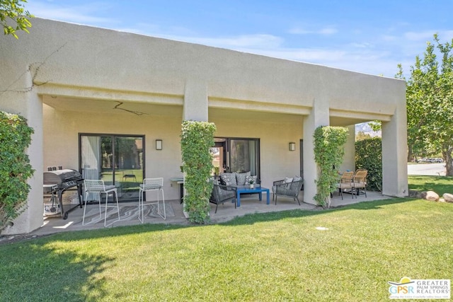 rear view of house with a yard and a patio