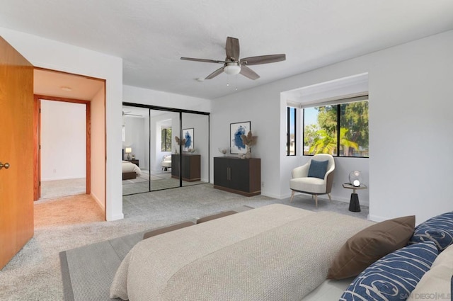 bedroom with carpet flooring, a closet, and ceiling fan