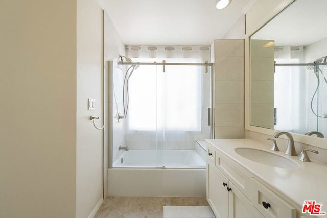 bathroom with vanity, tile patterned floors, and enclosed tub / shower combo