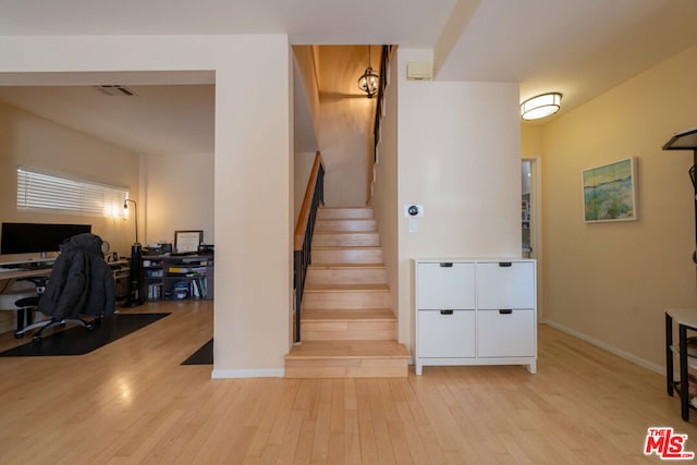 stairway with wood-type flooring