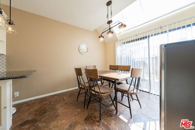 dining area with vaulted ceiling