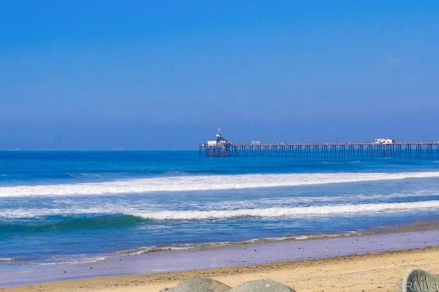 property view of water featuring a beach view