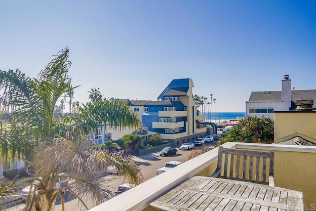 balcony featuring a water view