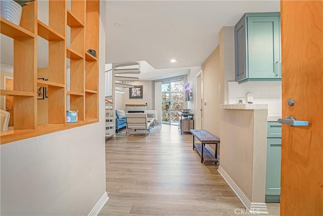 corridor featuring light hardwood / wood-style floors