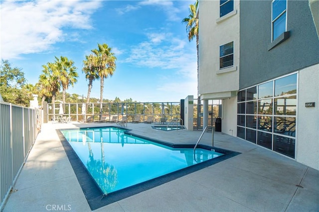 view of swimming pool featuring a patio area