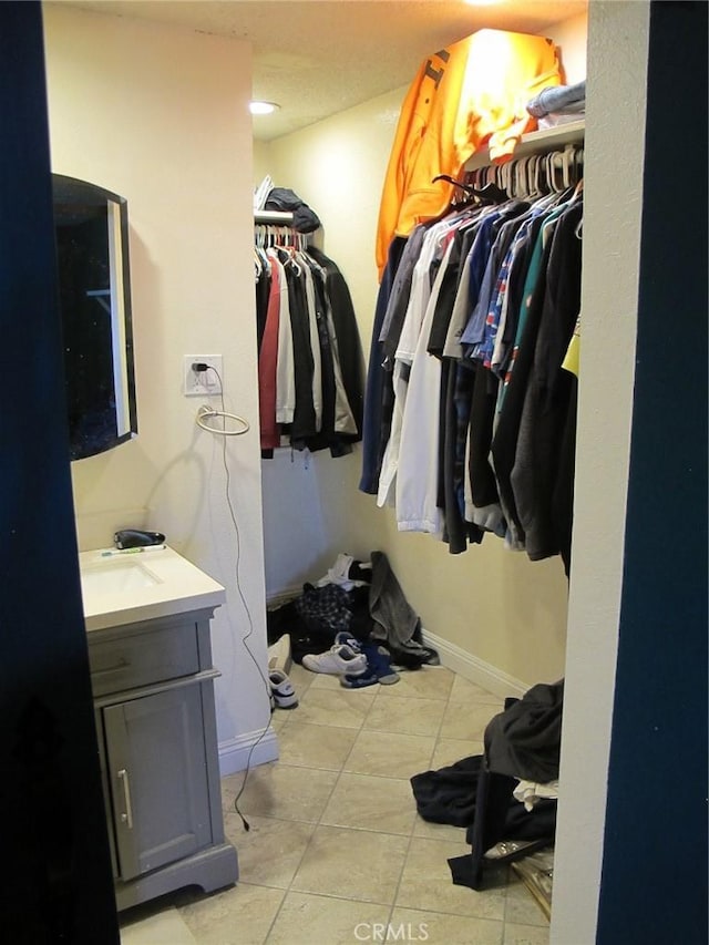 7928 Oakwood Ave, Hesperia, CA 92345 - spacious closet with sink and light tile patterned flooring