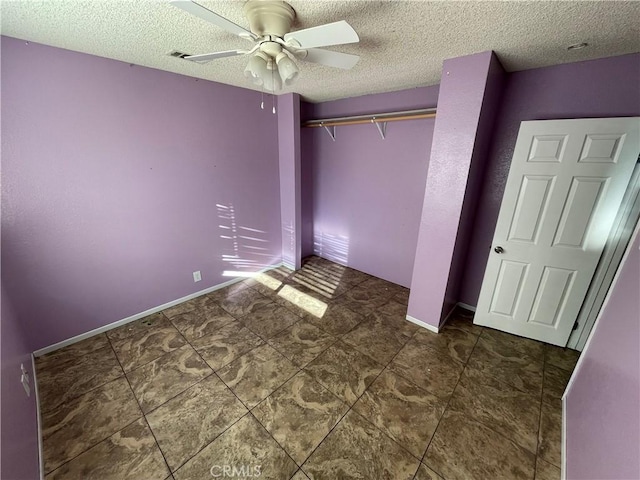 7928 Oakwood Ave, Hesperia, CA 92345 - unfurnished bedroom with a textured ceiling, a closet, and ceiling fan