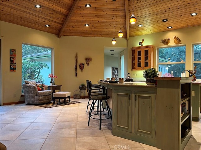 bar featuring pendant lighting, light tile patterned floors, wooden ceiling, and a wealth of natural light