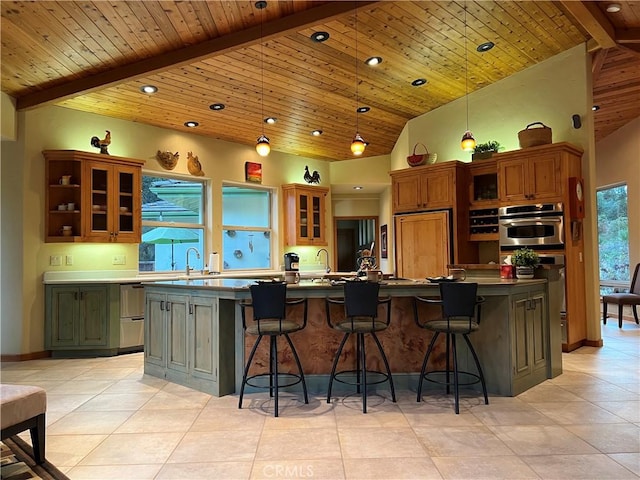 kitchen with wood ceiling, pendant lighting, high vaulted ceiling, beamed ceiling, and a kitchen island