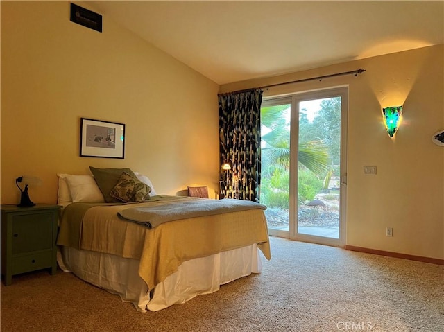 carpeted bedroom featuring access to exterior and vaulted ceiling