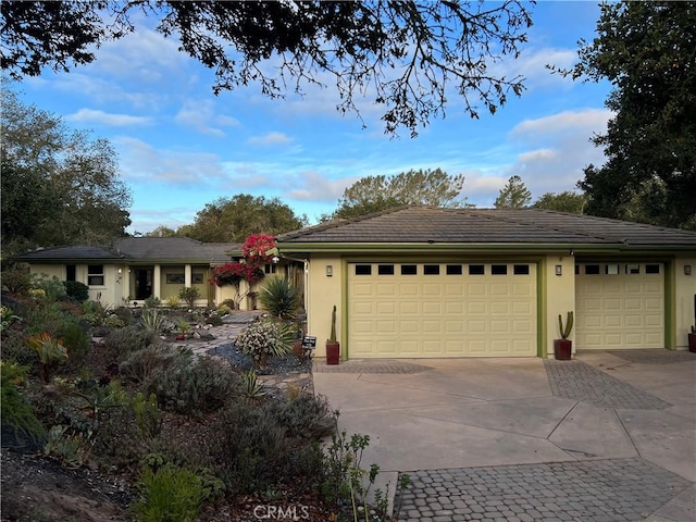 ranch-style house featuring a garage