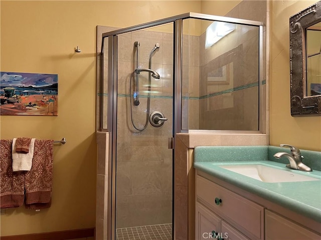 bathroom with vanity and an enclosed shower