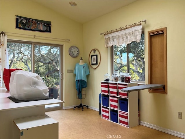 misc room featuring vaulted ceiling and a healthy amount of sunlight