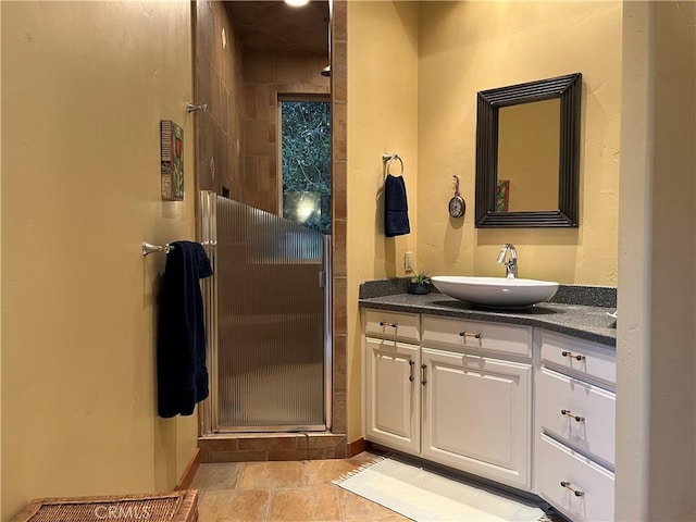 bathroom featuring vanity and an enclosed shower