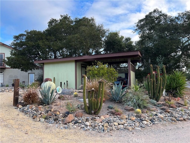 view of home's exterior featuring a carport