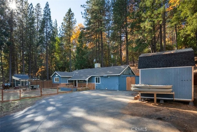 view of front of property with a storage unit