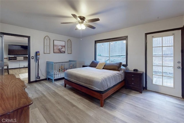 bedroom featuring light hardwood / wood-style flooring and ceiling fan