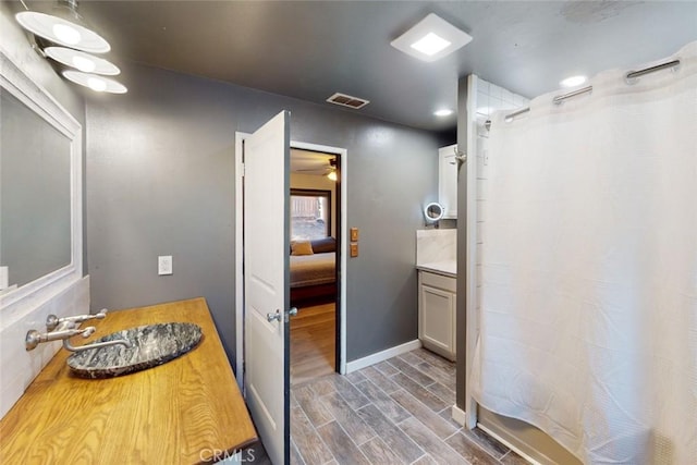 bathroom featuring sink and hardwood / wood-style flooring