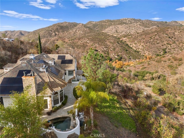 birds eye view of property featuring a mountain view