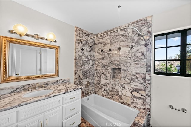 bathroom with vanity and tiled shower / bath combo