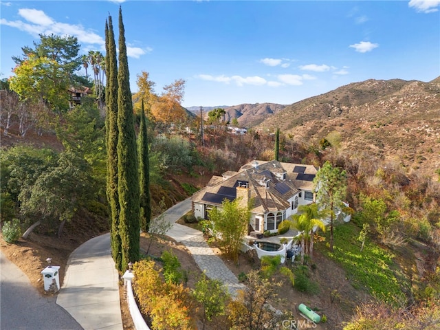 birds eye view of property featuring a mountain view