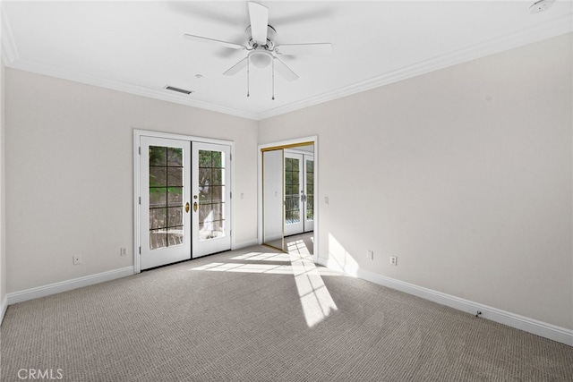 carpeted empty room with ceiling fan, french doors, and ornamental molding